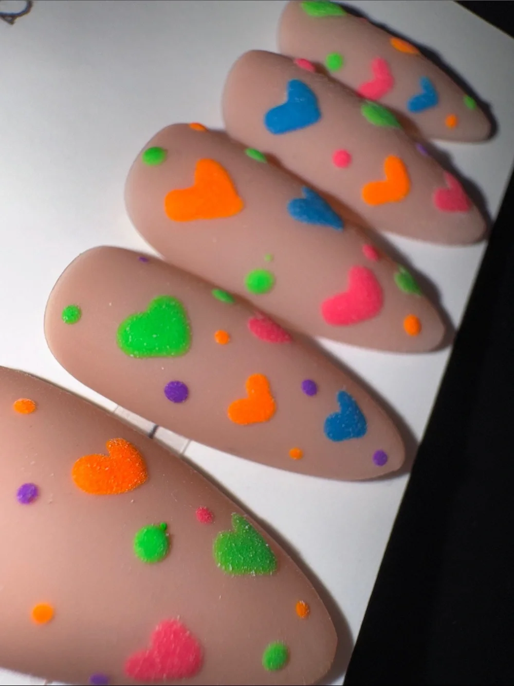 Nude Matte Press-On Nails with Neon Heart Accents